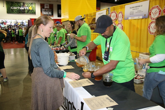 A volunteer pours out a taste, only one ounce! Photo 5 of 16